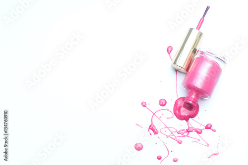 Pink nail polish on a white background with space for text 