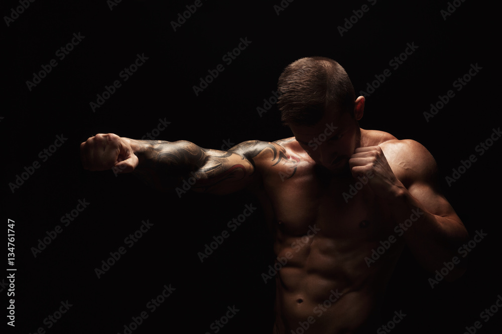 Fototapeta premium Strong athletic man showes naked muscular body