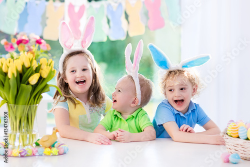 Kids with bunny ears on Easter egg hunt