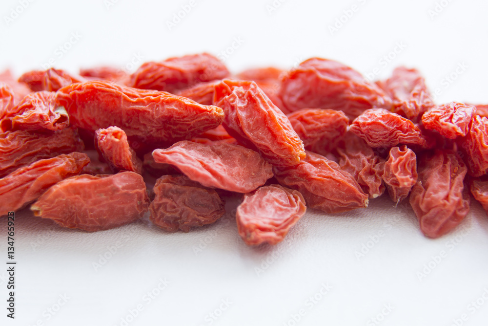 Goji berries are on white surface, macro Goji berries are on white surface, macro