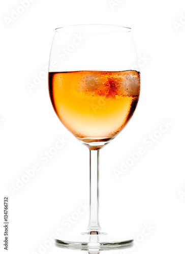 Drink in wine glass with ice cubes
