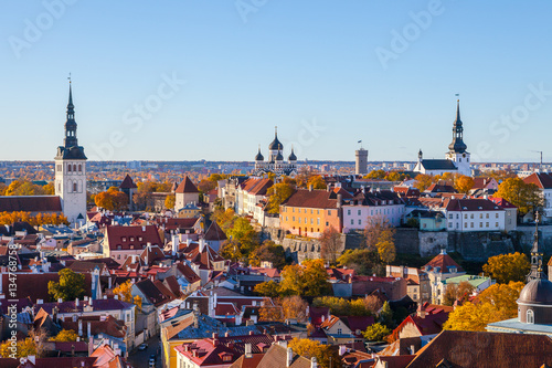 Niguliste church, Nevski Cathedral, Pikk Herman tower and Dome church. Towers and red roofs of old Tallinn, Estonia. Aerial view, autumn season