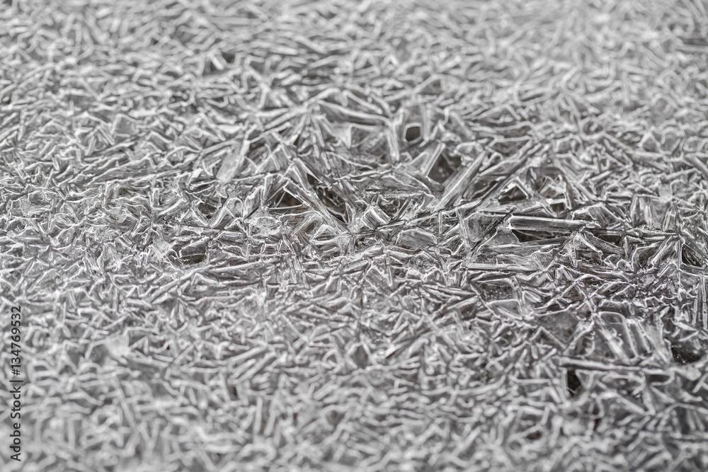 frosty pattern on winter window. texture of ice, cracks and sha frosty pattern on winter window. texture of ice, cracks and sha