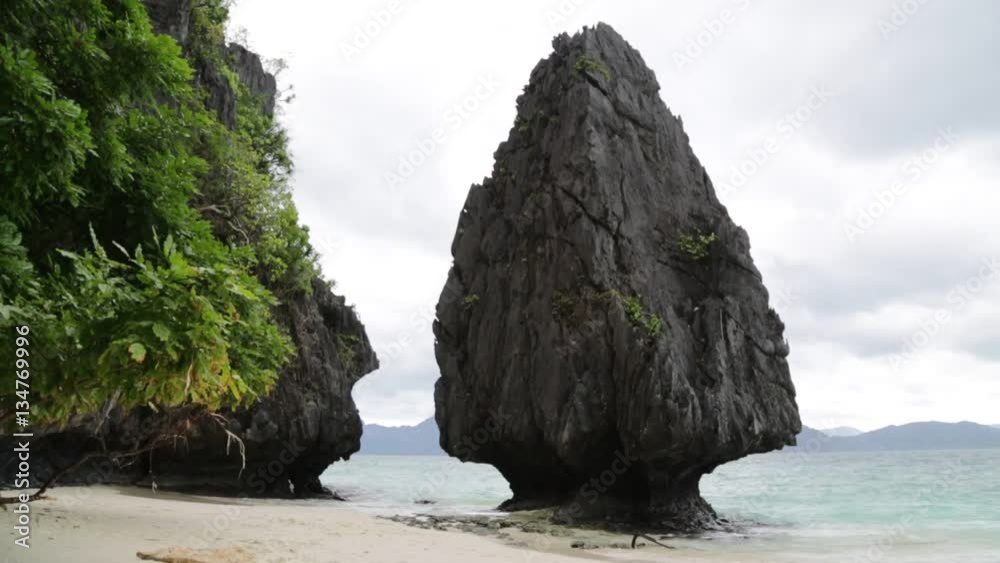 people in philippines wave of pacific ocean near rock hill and sandy beach concept of relax. people in philippines wave of pacific ocean near rock hill and sandy beach concept of relax.