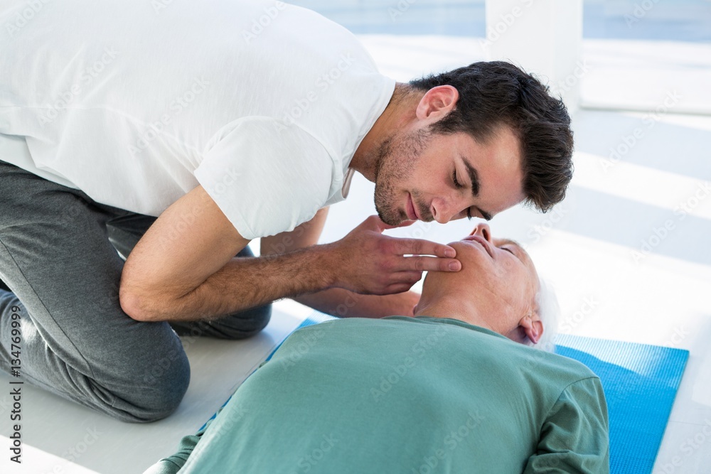 Paramedic performing resuscitation on patient Paramedic performing resuscitation on patient