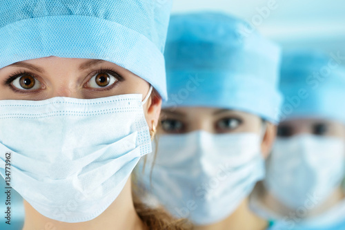 Close up portrait of young female surgeon doctor photo