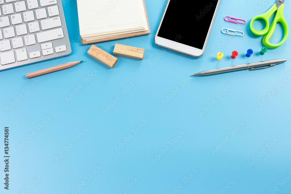 Office table with notebook, computer keyboard and smartphone. copy space Office table with notebook, computer keyboard and smartphone. copy space