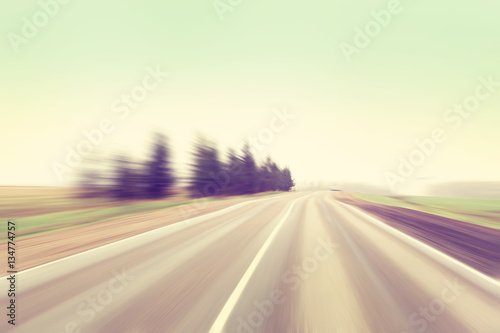 Motion blurred road in vintage color.