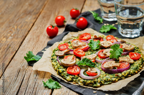 Kale oats pizza crust with tomato, red onion and mushrooms