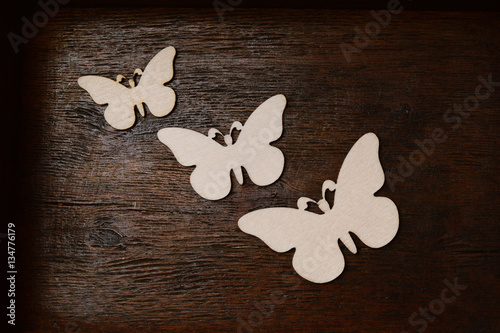 Canvas Print wooden butterfly on an old wooden background