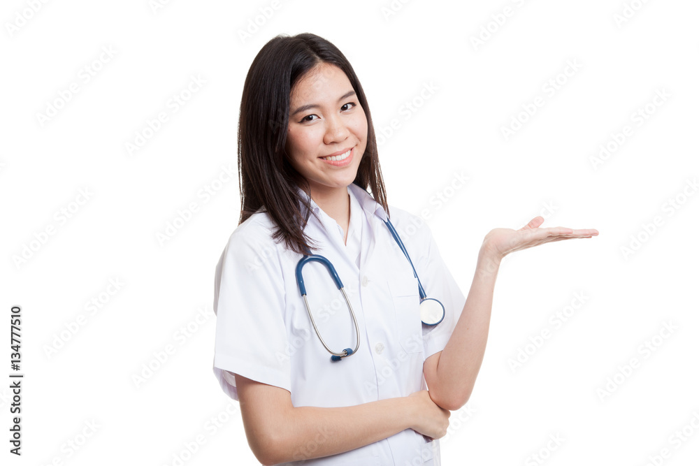 Asian young female doctor show something on her hand. Asian young female doctor show something on her hand.