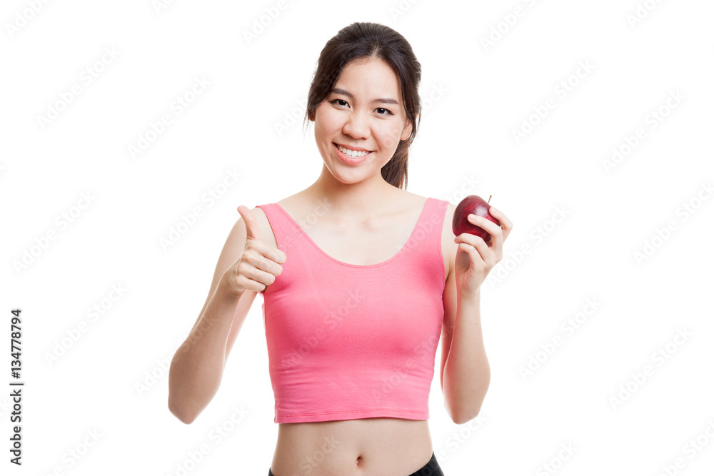 Beautiful Asian healthy girl thumbs up with apple. Beautiful Asian healthy girl thumbs up with apple.