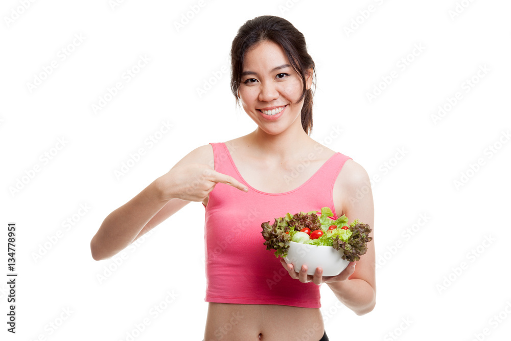 Beautiful Asian healthy girl point to salad. Beautiful Asian healthy girl point to salad.
