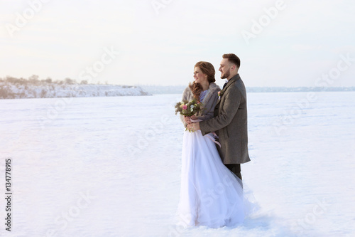 Happy wedding couple outdoo...