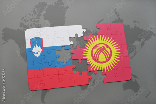 puzzle with the national flag of slovenia and kyrgyzstan on a world map
