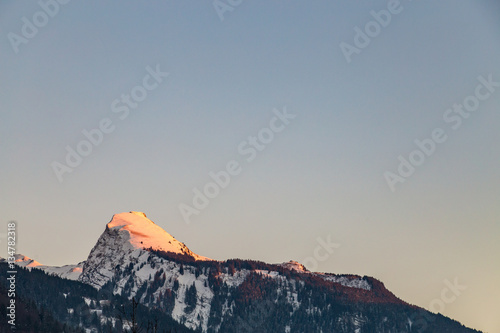 Snowy Mountain tops in the blue sky sun © kenzie
