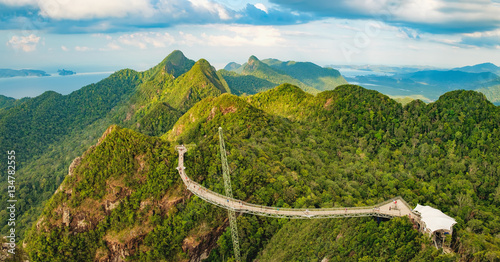 Panoramic view of Sky Bridge and Cable Car with mountains, sea and tropical forests in the background, Langkawi island, Malaysia. Langkawi SkyCab is one of the major attractions in the island © sonatalitravel