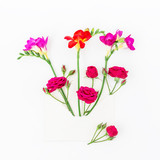 Pink and red freesia, envelope on white background, Flat lay, Top view