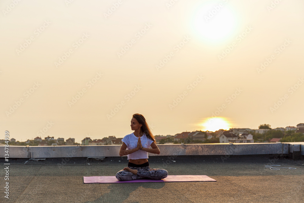 Fototapeta premium Young woman practicing yoga