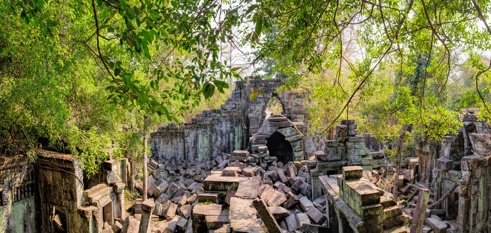 Prasat Beng Mealea in Angkor Complex, Siem Reap, Cambodia. It is largely unrestored, old trees and brush growing amidst towers and many of its stones lying in great heaps. Ancient Khmer architecture. Prasat Beng Mealea in Angkor Complex, Siem Reap, Cambodia. It is largely unrestored, old trees and brush growing amidst towers and many of its stones lying in great heaps. Ancient Khmer architecture.