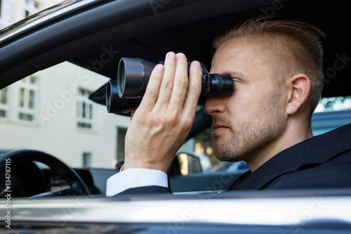 Man Looking Through Binocular © Andrey Popov