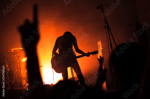 Silhouette of guitarist musician on stage