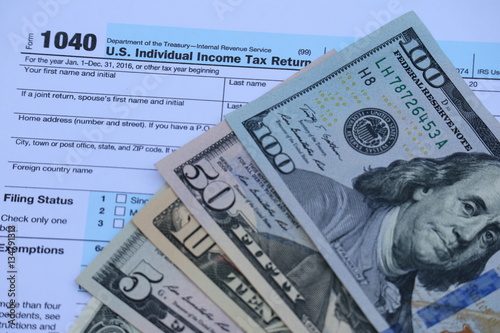 Wallpaper Mural US tax form, dollar cash, pen, calculator, finance accounting and tax season concept Torontodigital.ca