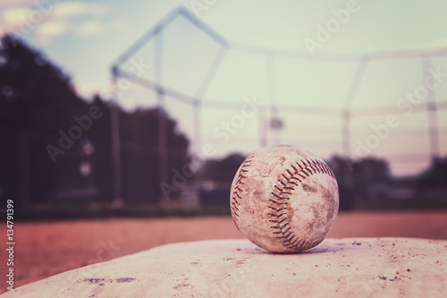Photography Baseball on a base. Vintage Instagram effect.