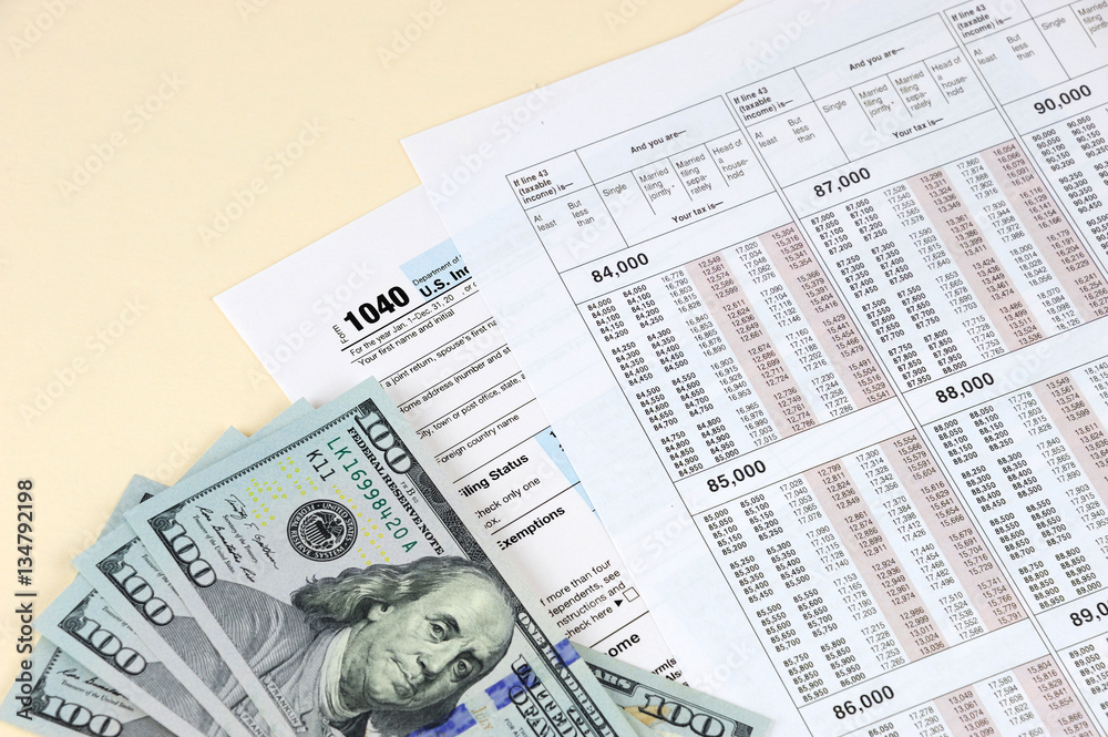 Obraz premium tax calculation form with USD dollar cash