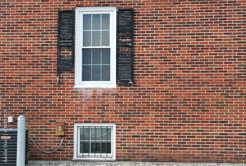 close up on damaged window shutter on brick wall close up on damaged window shutter on brick wall