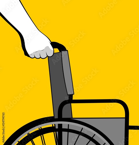 Hands pushing wheelchair