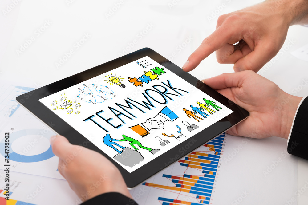 Businesspeople Discussing Teamwork On Digital Tablet Businesspeople Discussing Teamwork On Digital Tablet