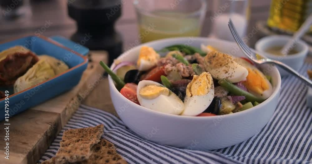 Dolly view of a fresh, healthy, organic nicoise salad Dolly view of a fresh, healthy, organic nicoise salad
