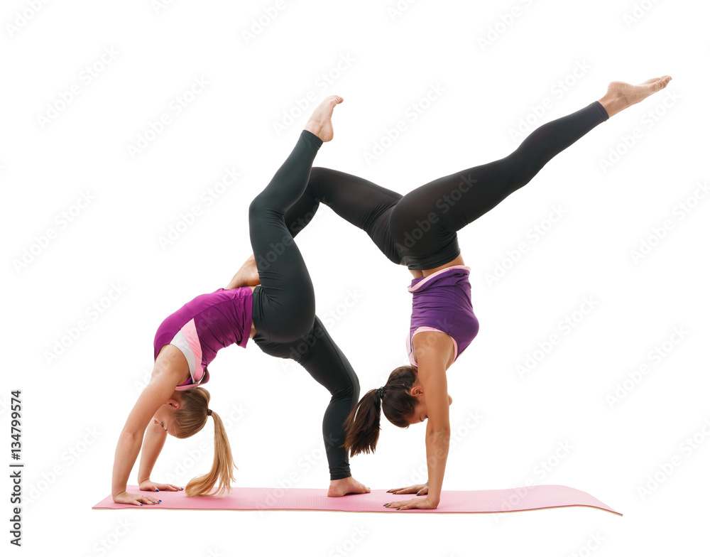 Slim sportswomen in tops and leggings in studio Slim sportswomen in tops and leggings in studio