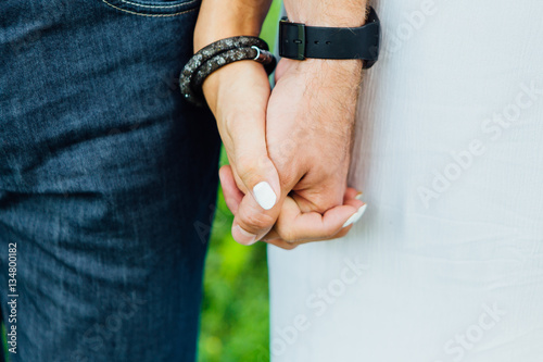 Close up hands of a man and woman