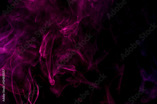 Abstract smoke Weipa. Personal vaporizers fragrant steam. The concept of alternative non-nicotine smoking. Magenta smoke on a black background. E-cigarette. Evaporator. Taking Close-up. Vaping.