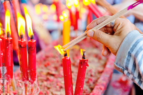 People light the candle at chinese temple