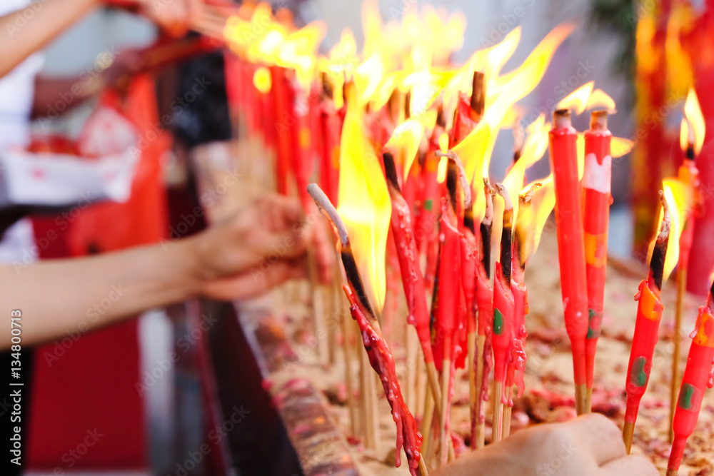 People light the candle at chinese temple