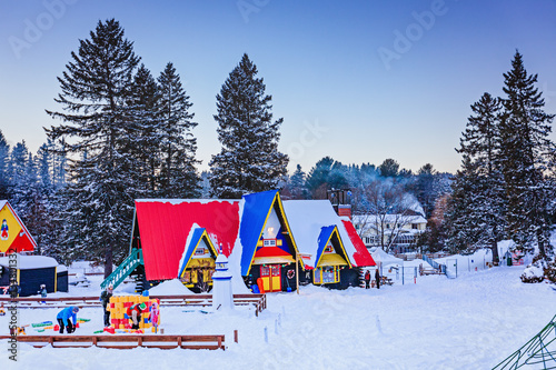 House in Santa Claus village in winter. Nice place to spend winter holidays active. Early evening. photo