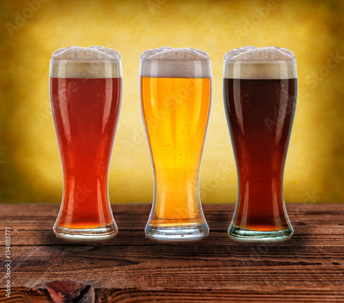 Three Beers on Wood Table
