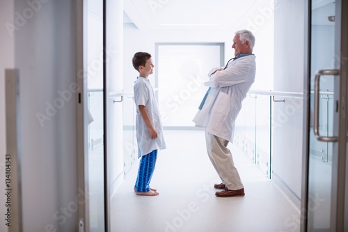 Doctor talking to boy patient