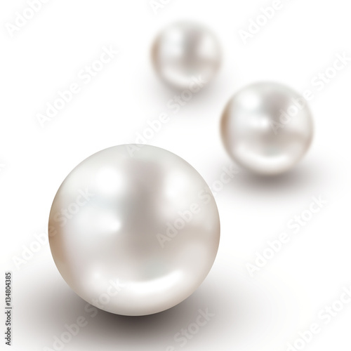 Three white pearls isolated on white with drop shadow