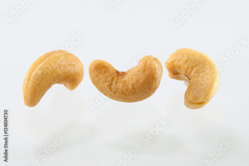 cashew nuts heap on white background photo