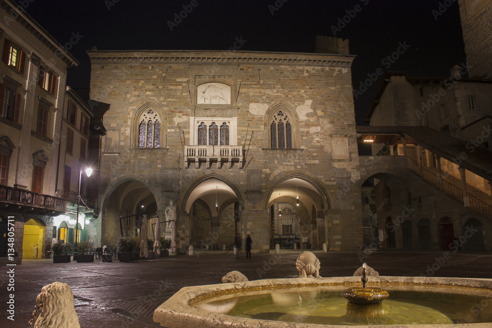 Bergamo - Old city (Citta Alta). One of the beautiful city in Italy. Lombardia. Landscape on the old main square (called Piazza Vecchia), the ancient Administration Headquarter and Contarini fountain.