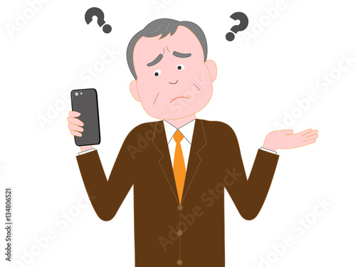 スマートフォンのトラブルに怒るシニアのビジネスマン