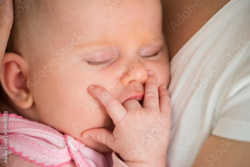 Baby Sleeping On Mom's Arm