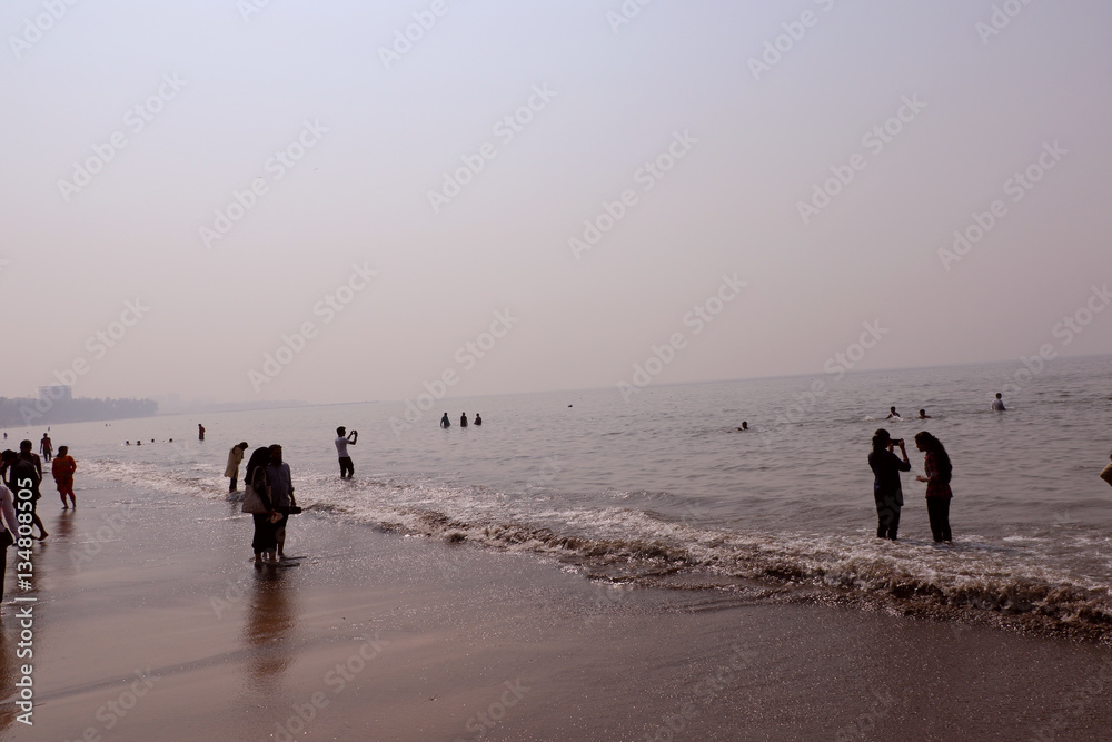 Indian crowd & tourist enjoying on popular Juhu Beach in Mumbai is one of the most famous Indian beaches. Juhu Beach is also famous for its local delicacies and street food. 