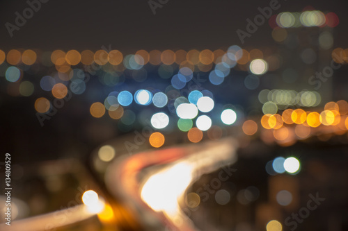 Concept photo for business design and planning. These blurred street lights and heavy traffic are shown in blue and yellow city lights.