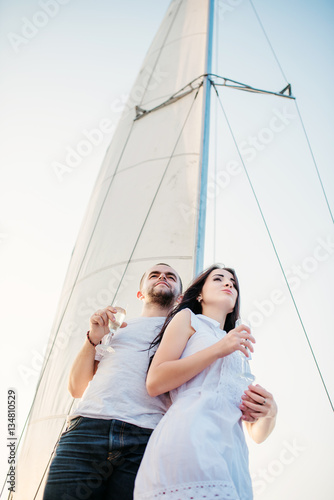 Young beautiful married couple in love at the yacht on vacation. © AS Photo Family
