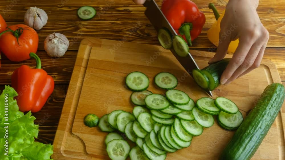 Tme-lapse of hands chopping cucumber and cooking salad, 4k vide Tme-lapse of hands chopping cucumber and cooking salad, 4k vide